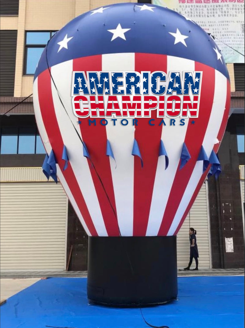 Load image into Gallery viewer, Large inflatable giant rooftop blimp from My Store, with bright colors and detailed design, floating on a clear sky background.