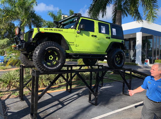 48-inch vehicle display ramp with Jeep, showcasing the sturdy level platform and rugged design for automotive presentations.
