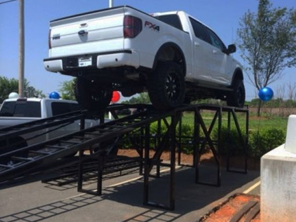 Load image into Gallery viewer, 60-inch car display ramp by My Store, showing a sturdy metal ramp designed for showcasing vehicles at an outdoor event.
