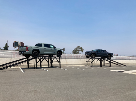 Screenshot of a 60-inch level car display ramp showcasing its design and measurements for vehicle maintenance and repair.