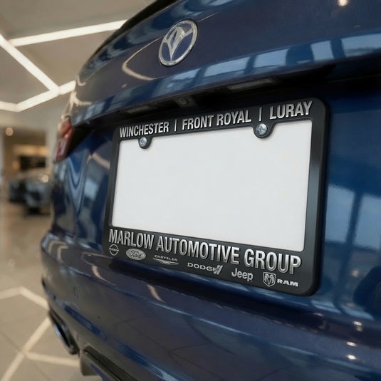 Black Custom License Plate Frame with raised chrome print, designed for vehicle license plates.