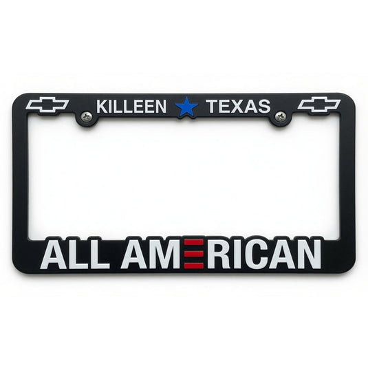 Black custom license plate frame with raised imprint in three colors, featuring bold design and durable material.
