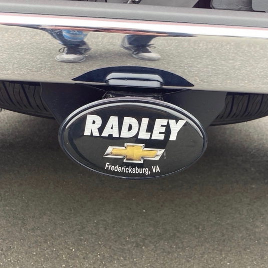 Close-up of a domed hitch cover from My Store, showcasing its sleek design and durable construction for trailer hitch protection.