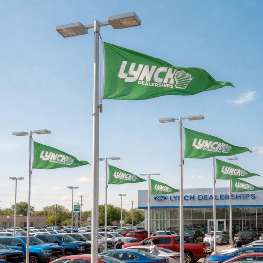 Custom printed triangle flags on light poles, featuring vibrant designs for outdoor decoration and event signage.